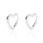 Chunky silver huggie earrings in a heart shape, featuring an open design and a polished finish.