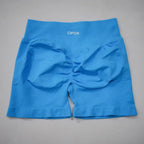 Bright blue high-waisted gym shorts with a seamless design and scrunch-butt detailing for enhanced silhouette.