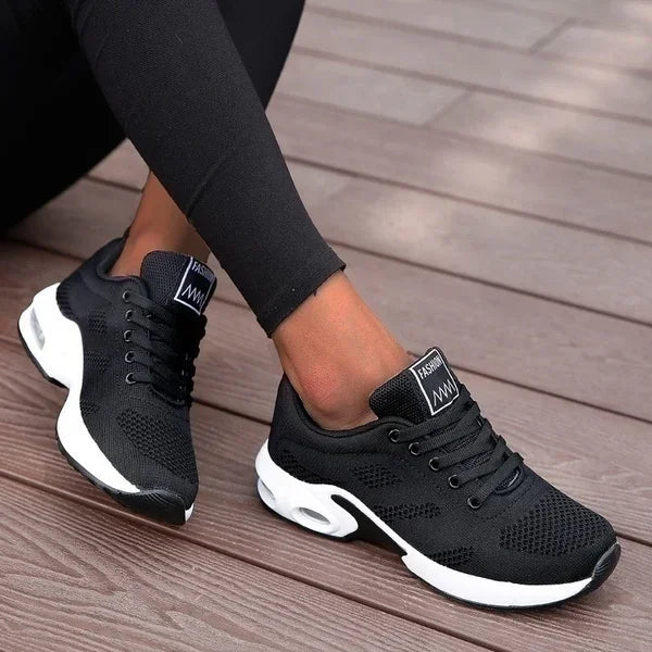 Black LOVORA™ Aura Air Boost Platform Premium Sneakers feature a breathable mesh upper, laced design, and a thick white platform sole.