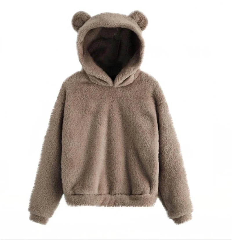 Cozy oversized hoodie in soft brown teddy fleece with plush bear ears and a relaxed fit, featuring deep side pockets.