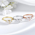 Three LOVORA™ Imperial Double Pear Cut Moissanite Statement Rings in yellow gold, silver, and rose gold, featuring dual pear-cut stones.