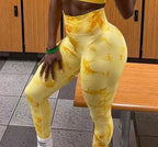High-waisted yellow leggings with a marble pattern, featuring a seamless design and a double-layered compression waistband.
