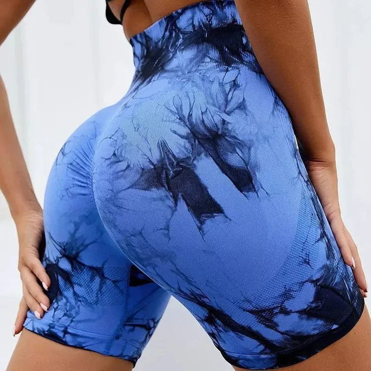High-waisted tie-dye gym shorts in blue and black, featuring a scrunch design for enhanced shape and comfort.