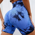 High-waisted tie-dye gym shorts in blue and black, featuring a scrunch design for enhanced shape and comfort.