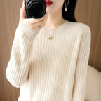 Cozy cream-colored LOVORA™ Classic Striped O-Neck pullover with ribbed texture, worn by a model holding a camera.