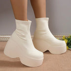 Ultra-chunky premium ankle boots in cream eco-leather with a smooth silhouette and elevated platform heel.