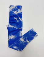 High-waisted blue leggings featuring a white abstract marbled pattern and seamless design for enhanced comfort and fit.