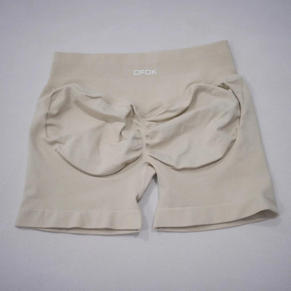 Beige LOVORA™ Sculpt & Lift Seamless High-Waisted Gym Shorts with a scrunch-butt design and wide waistband for tummy control.