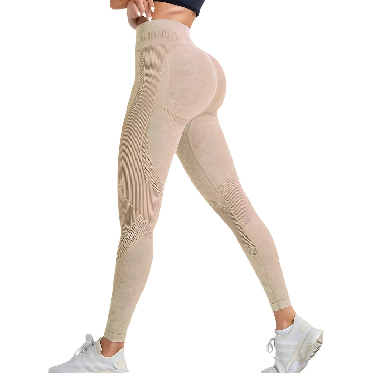 High-waisted, sand-washed leggings in a soft beige tone, featuring seamless design and subtle letter accents, paired with white sneakers.