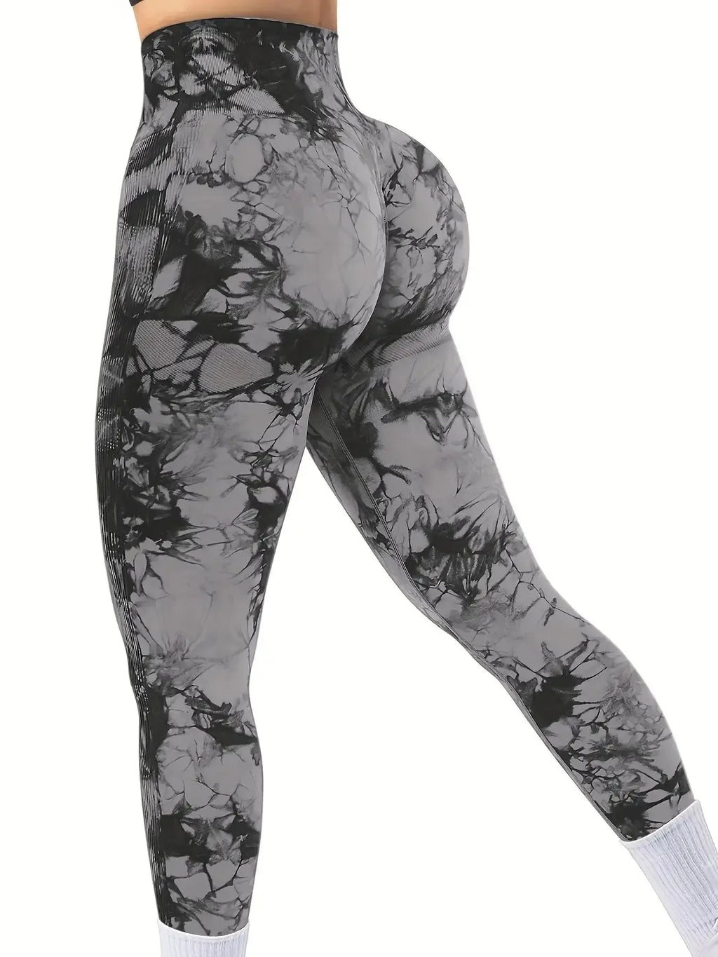High-waisted black and gray tie-dye leggings with scrunch butt detailing, showcasing a form-fitting silhouette.