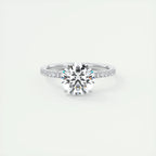 Round-cut Moissanite gemstone ring with a six-prong setting, featuring a silver band and subtle shimmering details.