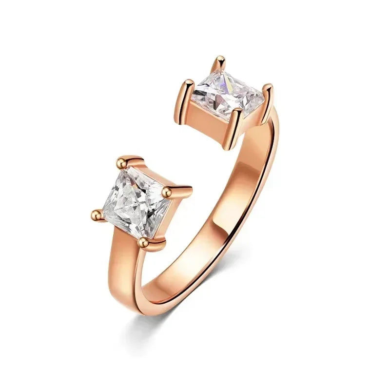 Adjustable rose gold ring featuring two princess-cut Moissanite stones set in a minimalist design.