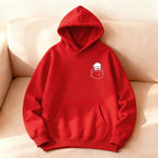 Red oversized hoodie featuring a cartoon bear in a pocket design, with a kangaroo front pocket and ribbed cuffs.