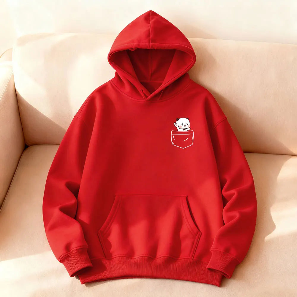 Red oversized hoodie featuring a cartoon bear in a pocket design, with a kangaroo front pocket and ribbed cuffs.