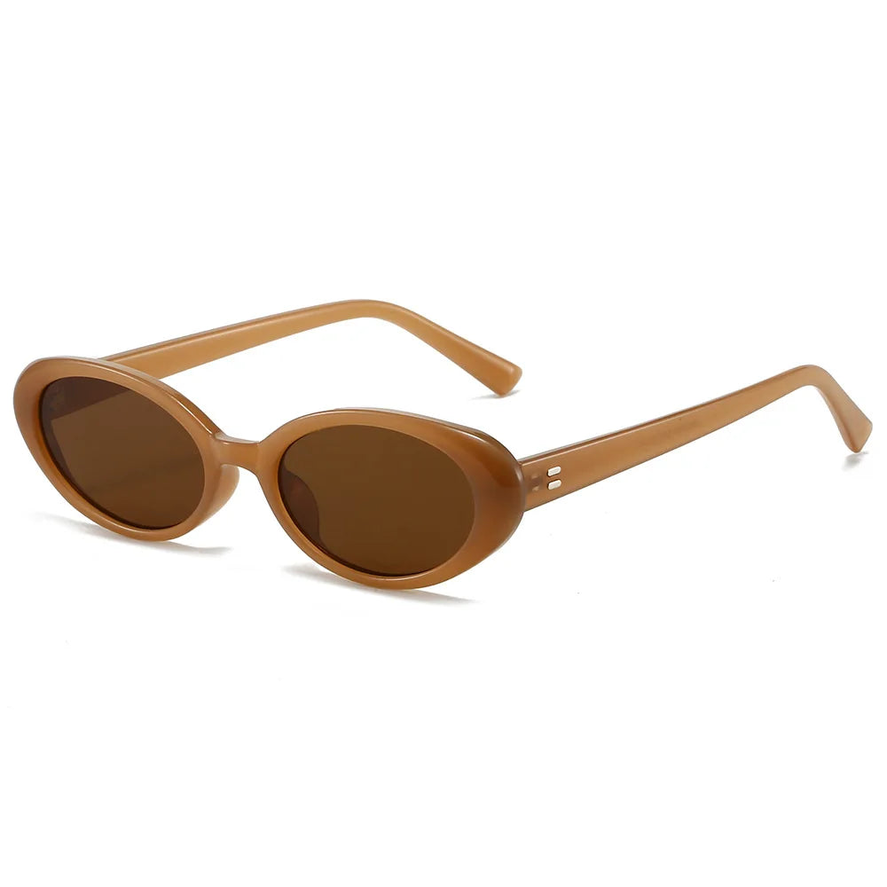 Oval-shaped sunglasses with a light brown frame and dark brown lenses, featuring a minimalist design and sleek lines.