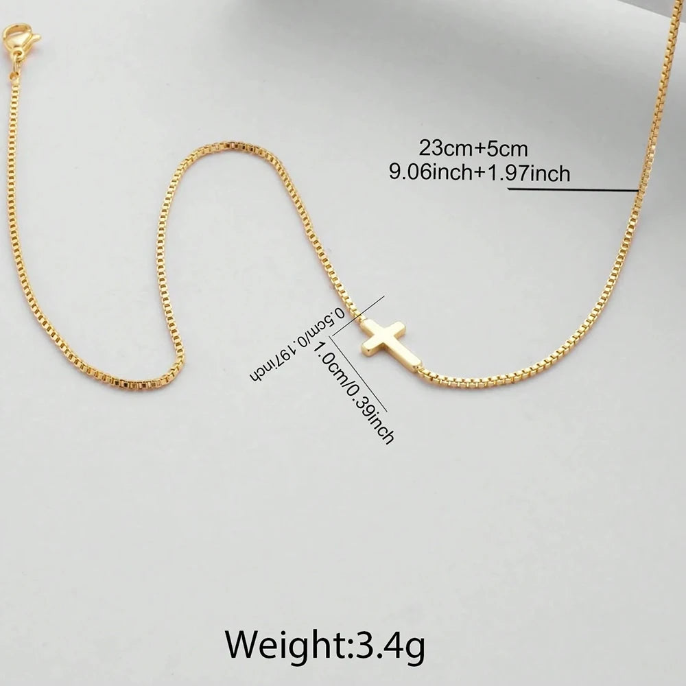 18K gold plated minimalist cross necklace with a delicate chain, showcasing a high-polish micro cross pendant.