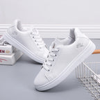 Breathable white LOVORA™ Blossom sneakers featuring floral embroidery, lace-up closure, and soft low-profile ankle collar.