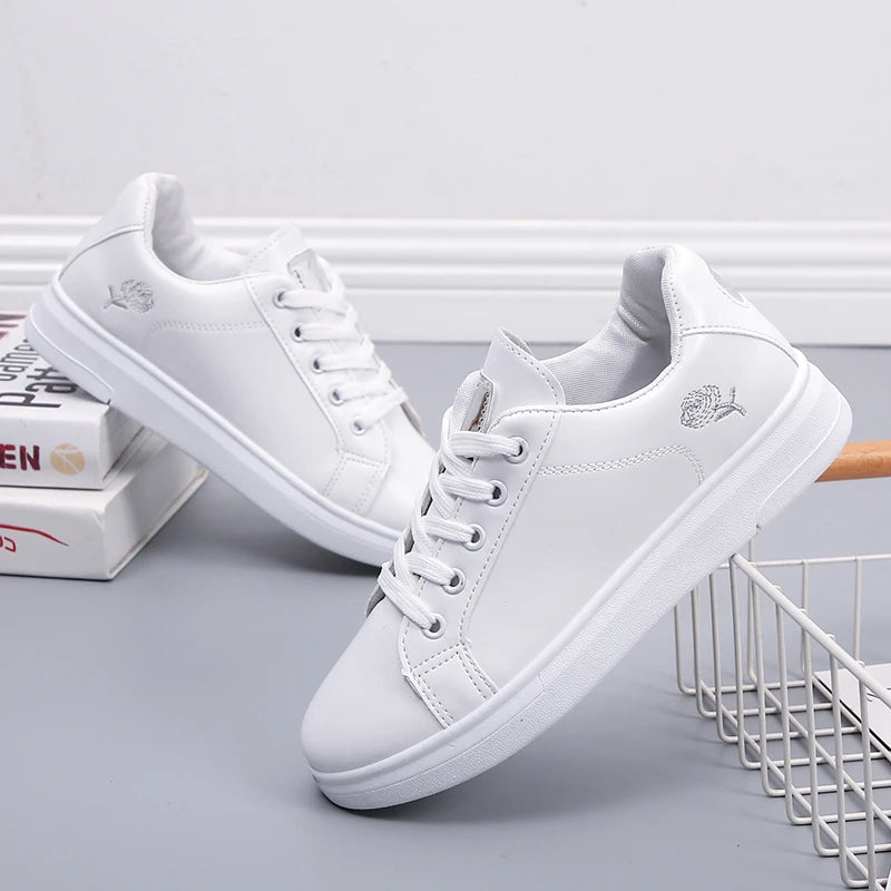 Breathable white LOVORA™ Blossom sneakers featuring floral embroidery, lace-up closure, and soft low-profile ankle collar.