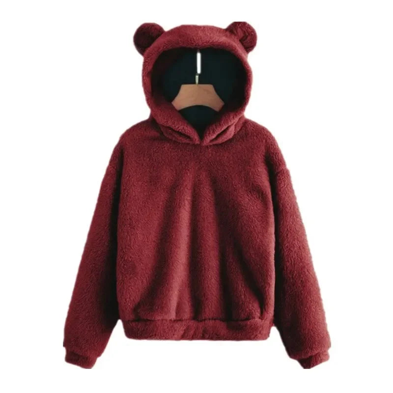 Cozy oversized hoodie in deep red plush fleece with bear ears, relaxed fit, and deep side pockets.