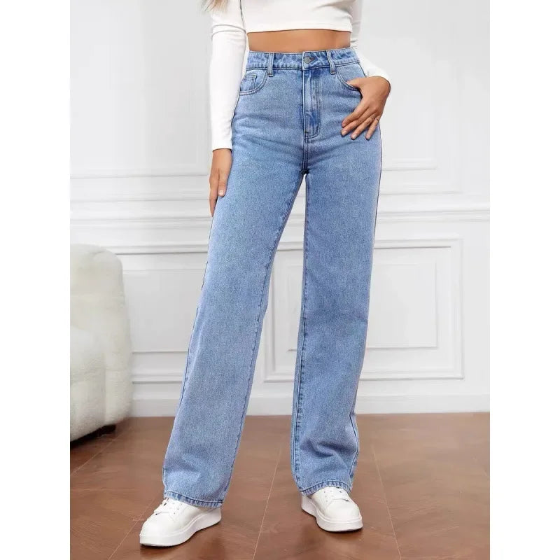 High-waisted, wide-leg denim jeans in light blue, featuring a classic five-pocket design, styled with a cropped white top.