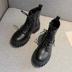 Black LOVORA™ Combat Matrix Chunky Platform Premium Boots featuring a lace-up design, padded collar, and thick, sculpted sole.