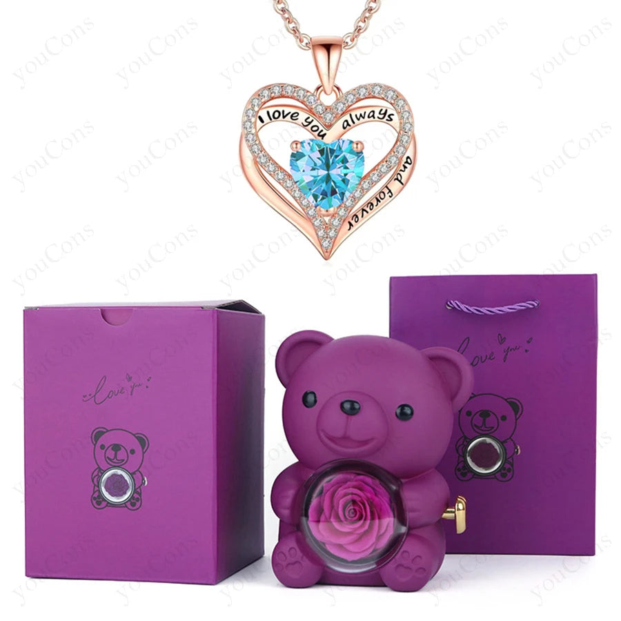 Luxury heart necklace gift set featuring a sculpted red heart pendant, artisan crystal teddy bear, and preserved rose in a stylish box.