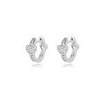 Chunky huggie earrings in stainless steel featuring a heart drop design with sparkling accents.