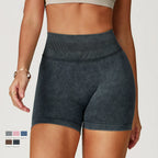 High-waisted, dark gray seamless gym shorts with a sand-washed texture and supportive waistband.