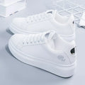 White LOVORA™ Blossom sneakers featuring floral embroidery, lace-up design, and cushioned soles, presented from the side.
