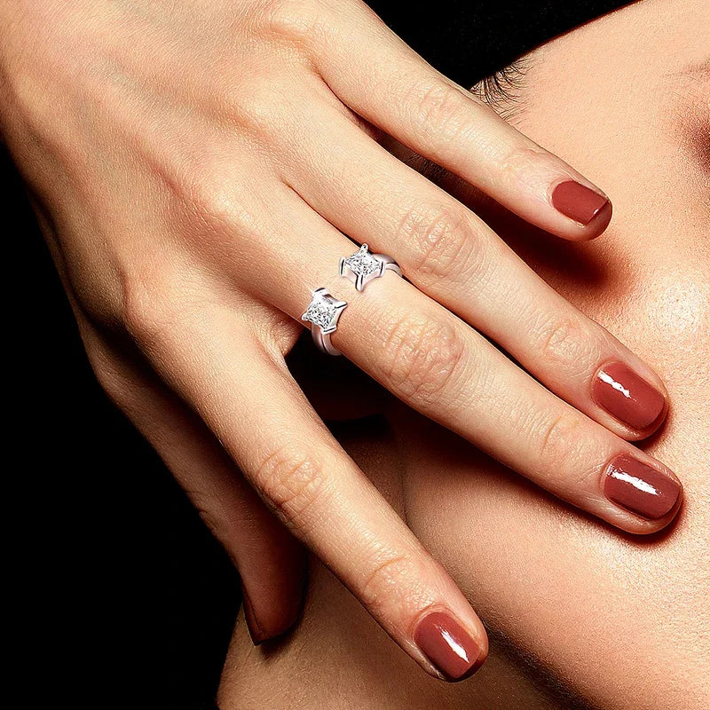 Adjustable LOVORA™ Aura Princess Cut ring featuring a square Moissanite stone, displayed on a model's hand with polished nails.