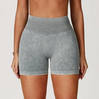 High-waisted gray seamless gym shorts with a sand-washed texture and thick waistband, designed for comfort and support.