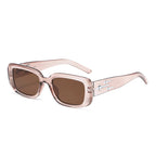 LOVORA™ Aura Cyber-Punk Y2K Sporty Sunglasses in transparent light pink with brown tinted lenses and silver accent details.