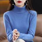 Light blue turtleneck sweater made from merino wool and cashmere, featuring ribbed trim and a relaxed fit.