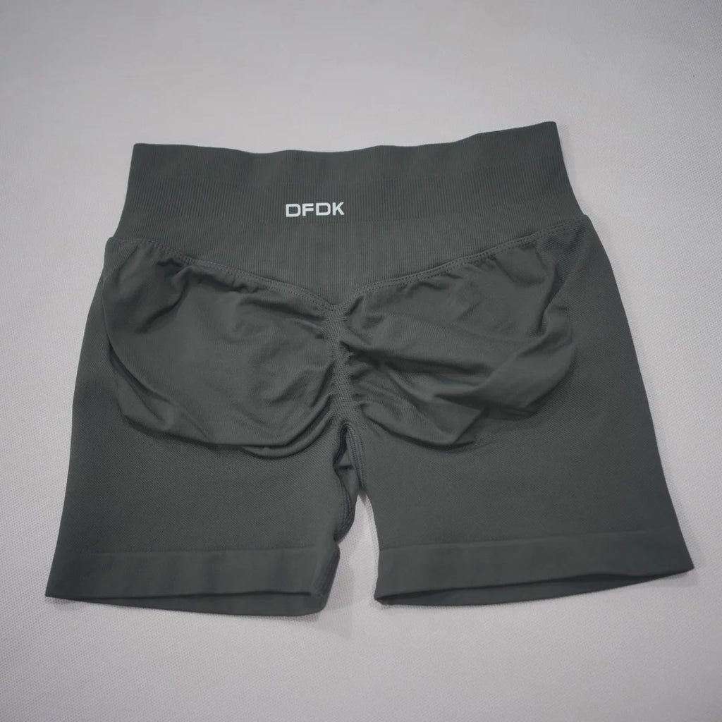 High-waisted black gym shorts featuring a scrunch-butt design and seamless fabric for comfort and support.