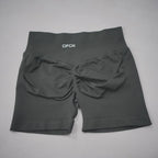 High-waisted black gym shorts featuring a scrunch-butt design and seamless fabric for comfort and support.
