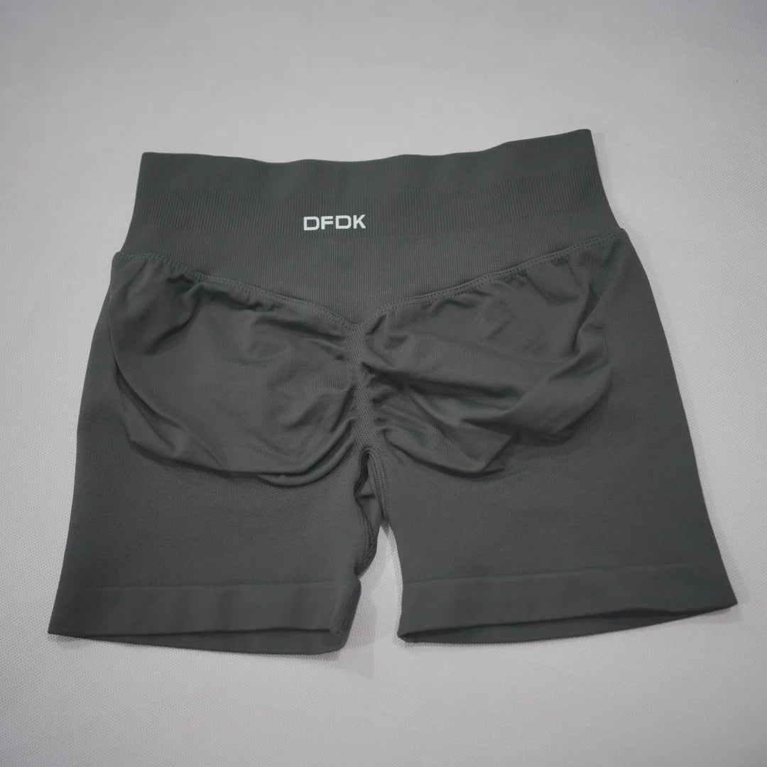 High-waisted black gym shorts featuring a scrunch-butt design and seamless fabric for comfort and support.