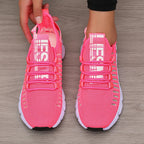 Bright pink LOVORA™ Aura Breathable Knitted Performance Sneakers feature a slip-on design and lace-up detail, showcasing a lightweight mesh upper.