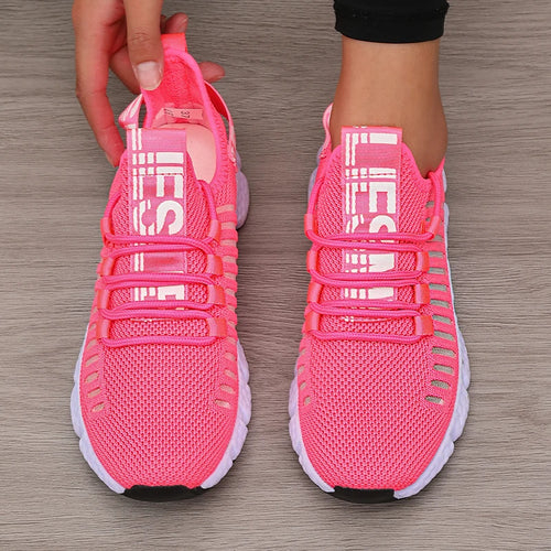 Bright pink LOVORA™ Aura Breathable Knitted Performance Sneakers feature a slip-on design and lace-up detail, showcasing a lightweight mesh upper.