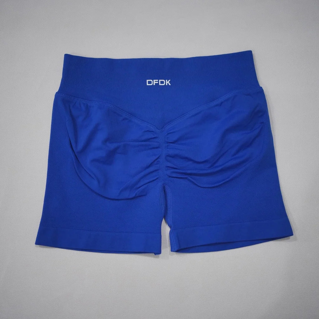 High-waisted gym shorts in vibrant royal blue with a seamless design and scrunch-butt feature for enhanced shape.