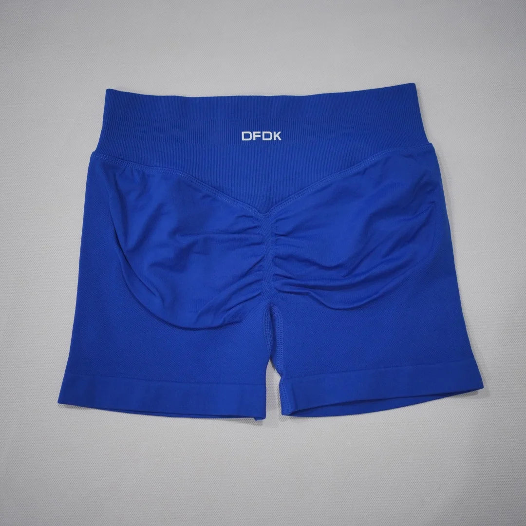 High-waisted gym shorts in vibrant royal blue with a seamless design and scrunch-butt feature for enhanced shape.