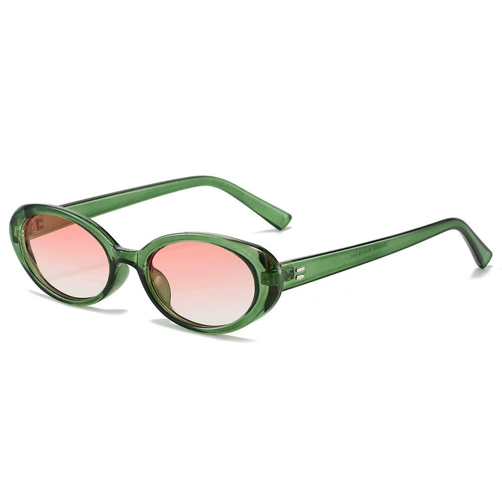 Oval minimalist sunglasses with a green translucent frame and pink gradient lenses, showcasing a vintage style.