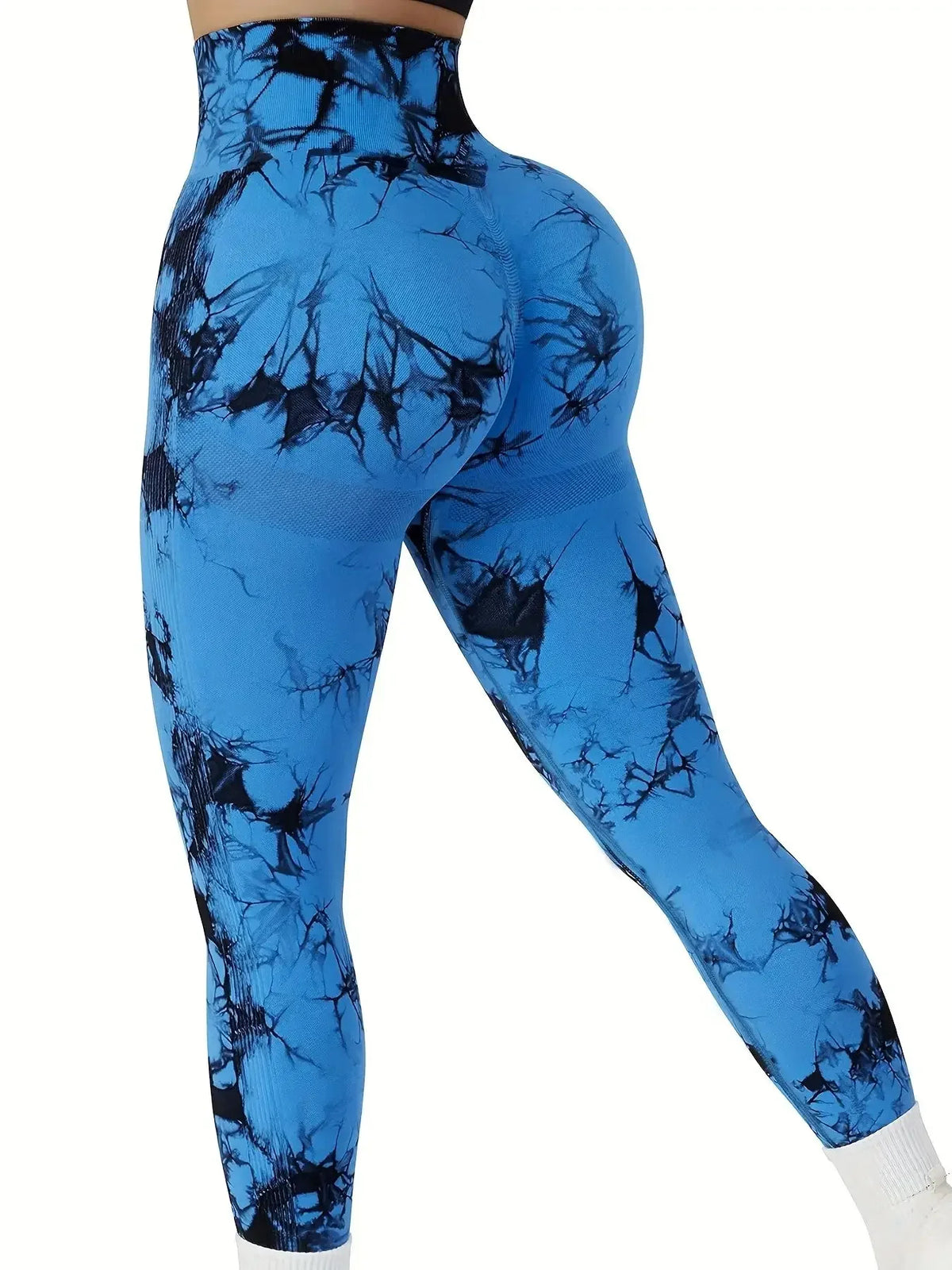 High-waisted blue tie-dye leggings with scrunch detailing, showing a contoured fit and breathable, stretchy fabric.