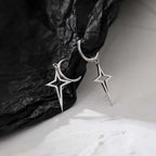 Gothic Cyber-Punk Hollow Star Drop Earrings feature a metallic dark silver tone in an asymmetric star design with cross drops.