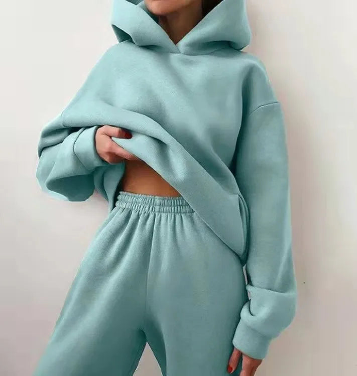 Cozy teal high-waisted tracksuit set featuring an oversized pullover hoodie and matching joggers.