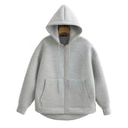 Gray oversized zip-up hoodie with a double-layered hood, ribbed cuffs, and front kangaroo pockets.