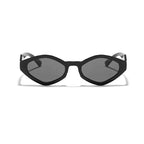 Bold black cat-eye sunglasses with thick frames and tinted lenses, showcasing a vintage-inspired design.