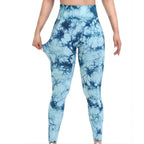 Premium tie-dye seamless scrunch butt leggings in blue and navy, featuring a high-rise waist and body-hugging fit.