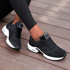 Black LOVORA™ Aura Air Boost Platform Sneakers feature a breathable mesh upper, white cushioning sole, and sleek design.