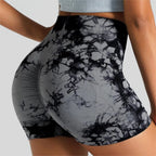 High-waisted gym shorts in a black and gray tie-dye pattern, featuring a scrunch design for enhanced shape and comfort.