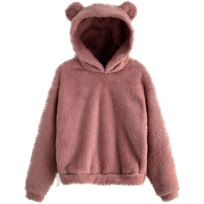Cozy oversized hoodie in soft pink teddy fleece, featuring plush bear ears and a relaxed fit with deep side pockets.